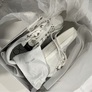 JIMMY CHOO
Hawaii crystal-embellished perforated leather sneakers